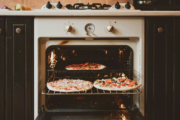 What factors should you consider when purchasing a countertop convection oven for even baking?